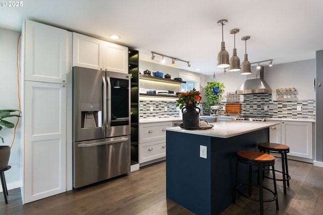 kitchen with white cabinetry, ventilation hood, stainless steel refrigerator with ice dispenser, and open shelves