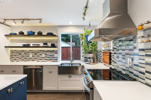 kitchen featuring open shelves, a sink, range hood, appliances with stainless steel finishes, and light countertops