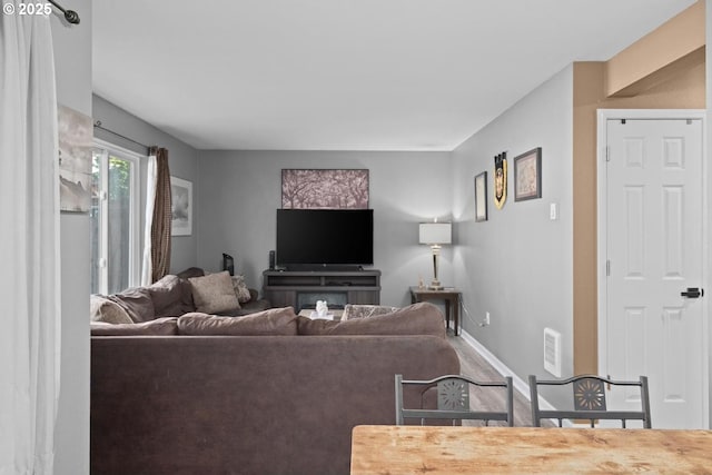 7143 SW Sagert St Unit 104, Tualatin, OR 97062 - living area with baseboards and wood finished floors