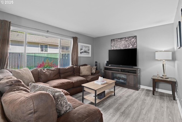 7143 SW Sagert St Unit 104, Tualatin, OR 97062 - living area with light wood-style floors and baseboards
