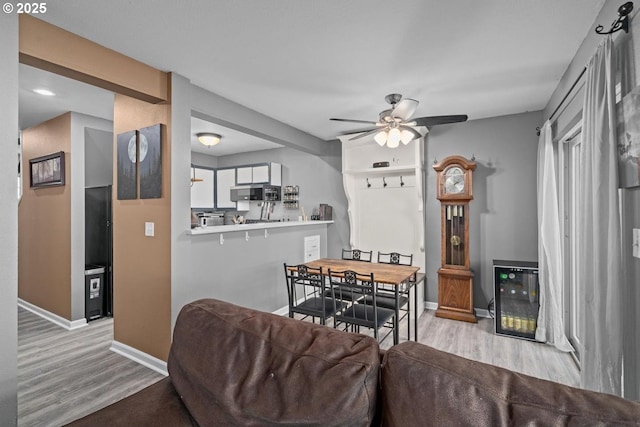 7143 SW Sagert St Unit 104, Tualatin, OR 97062 - dining area with wood finished floors, ceiling fan, and baseboards