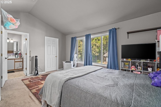 7143 SW Sagert St Unit 104, Tualatin, OR 97062 - bedroom featuring vaulted ceiling, carpet, and connected bathroom