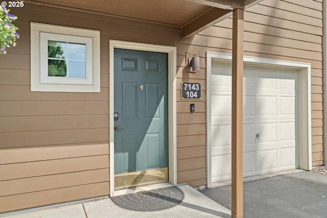 7143 SW Sagert St Unit 104, Tualatin, OR 97062 - entrance to property with a garage