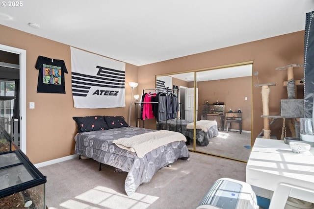 7143 SW Sagert St Unit 104, Tualatin, OR 97062 - bedroom with carpet, a closet, and baseboards