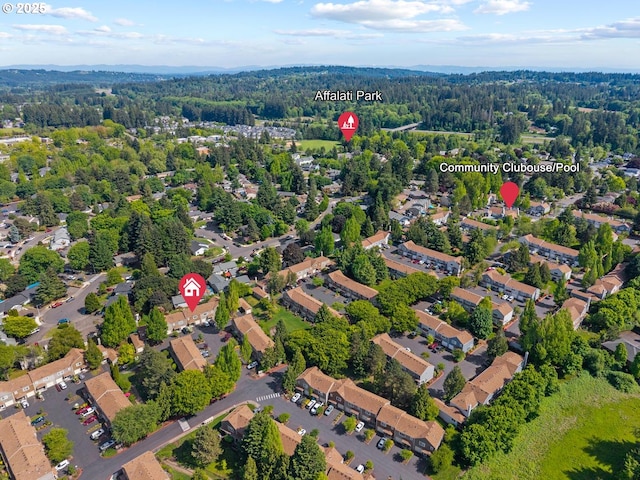 7143 SW Sagert St Unit 104, Tualatin, OR 97062 - aerial view of property and surrounding area with a heavily wooded area