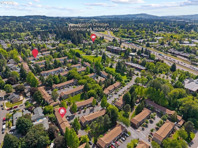 7143 SW Sagert St Unit 104, Tualatin, OR 97062 - aerial view of property and surrounding area featuring a forest