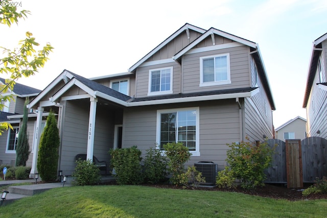 craftsman inspired home with a front lawn