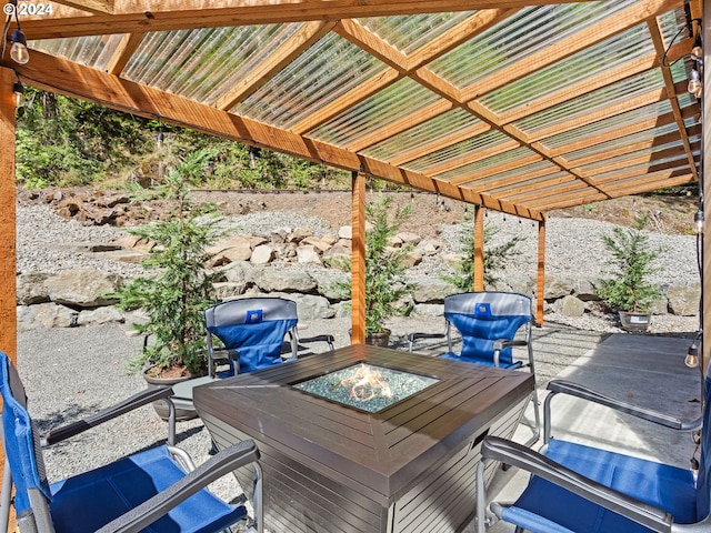 deck featuring an outdoor fire pit and a patio area