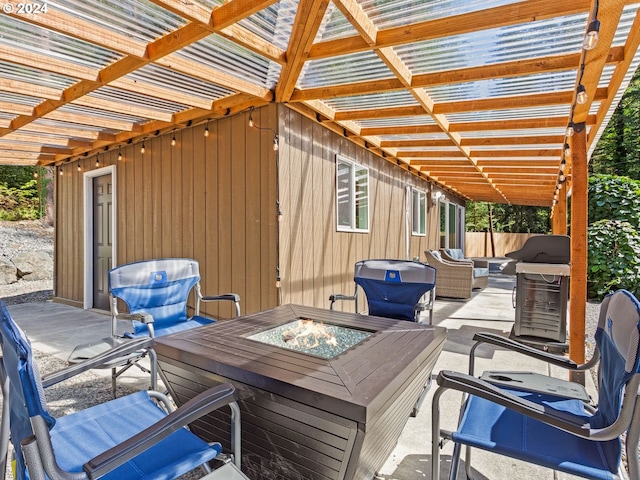 wooden terrace with a grill, an outdoor living space with a fire pit, and a pergola