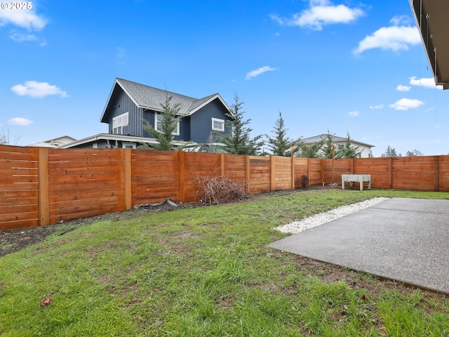 view of yard with a fenced backyard and a patio