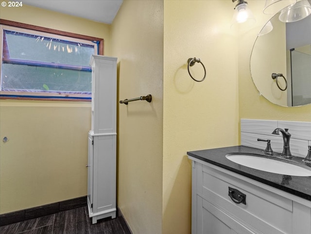 bathroom featuring vanity and hardwood / wood-style flooring