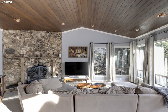 living room featuring lofted ceiling, wood ceiling, and a fireplace