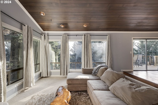 living room with lofted ceiling, a healthy amount of sunlight, and wood ceiling