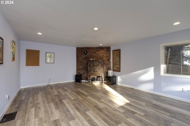 unfurnished living room featuring light wood-type flooring