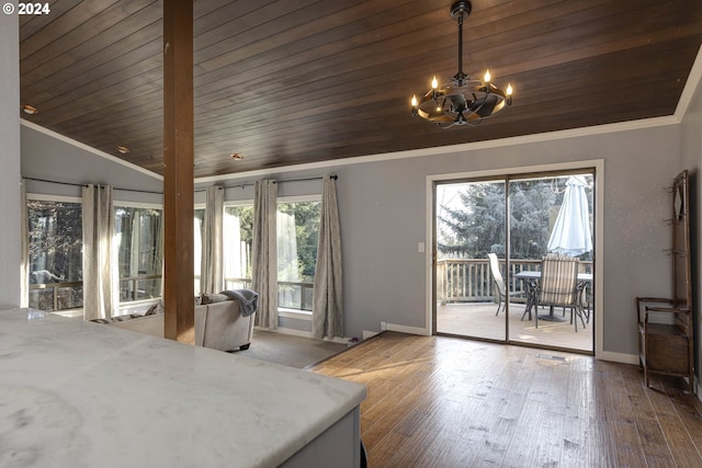 bedroom with vaulted ceiling, multiple windows, wooden ceiling, and a notable chandelier