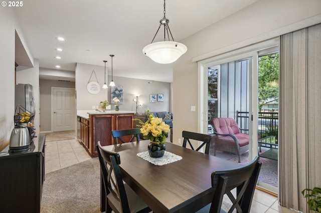 dining area with light tile patterned flooring