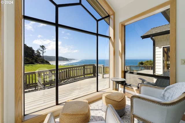 sunroom with a healthy amount of sunlight and a water view