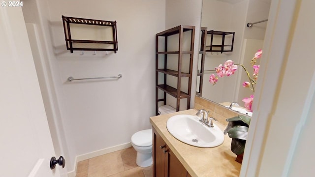 bathroom featuring vanity, toilet, and tile patterned floors