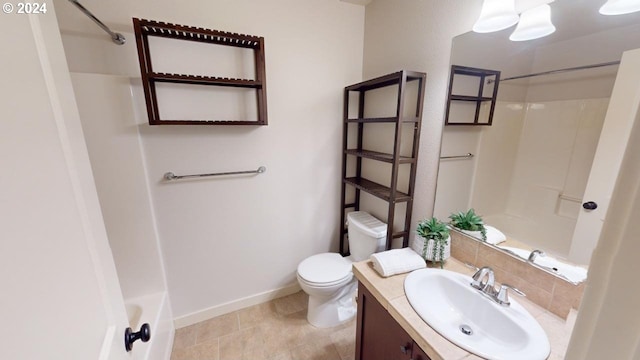 full bathroom with backsplash, vanity, washtub / shower combination, and toilet