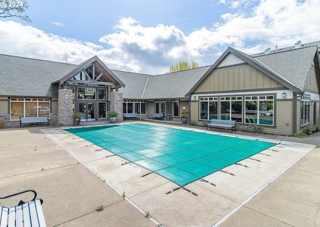 view of swimming pool with a patio area