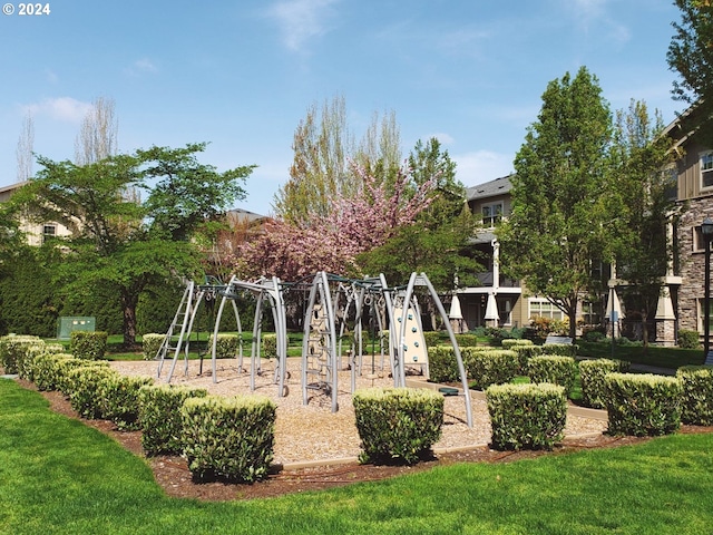 view of community with a lawn and a playground