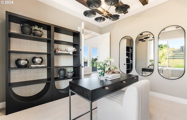 office area featuring ceiling fan with notable chandelier