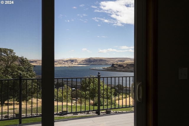 balcony featuring a water view