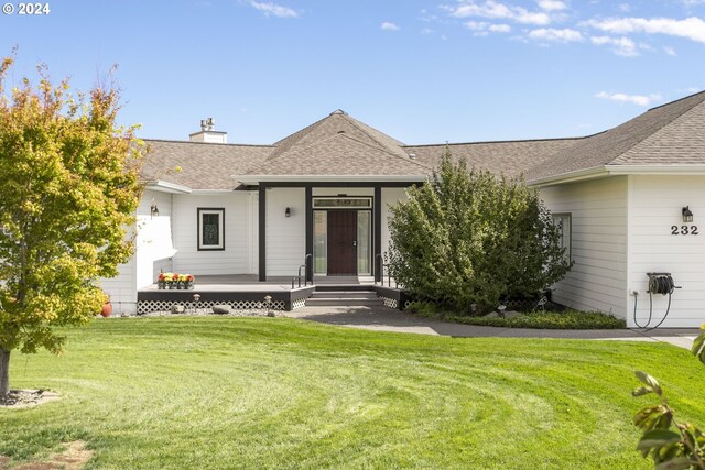 ranch-style house with a front yard