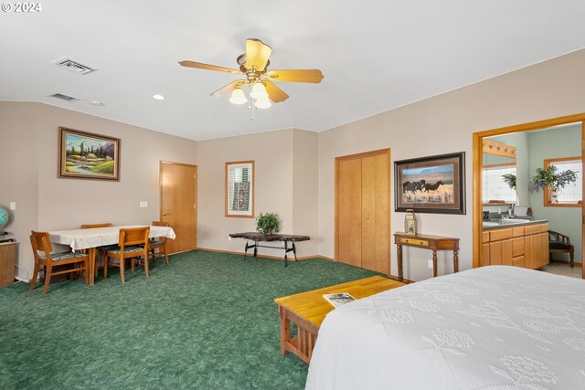 carpeted bedroom with multiple windows and ceiling fan