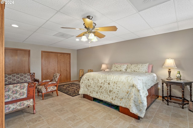 bedroom featuring a paneled ceiling and ceiling fan