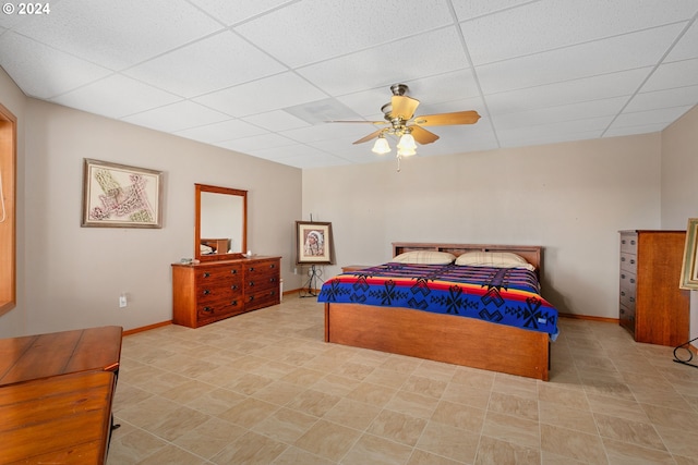 bedroom featuring a paneled ceiling and ceiling fan