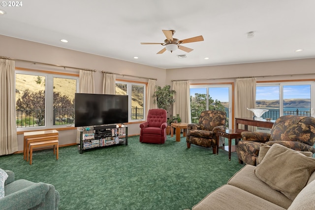 living room with carpet flooring and ceiling fan