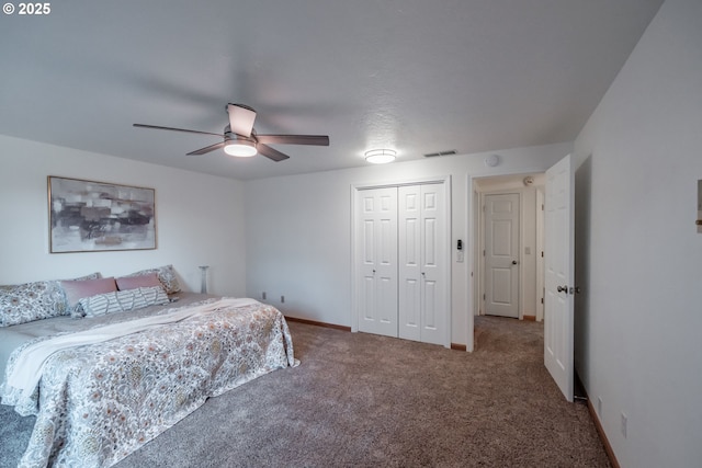 carpeted bedroom with a closet and ceiling fan