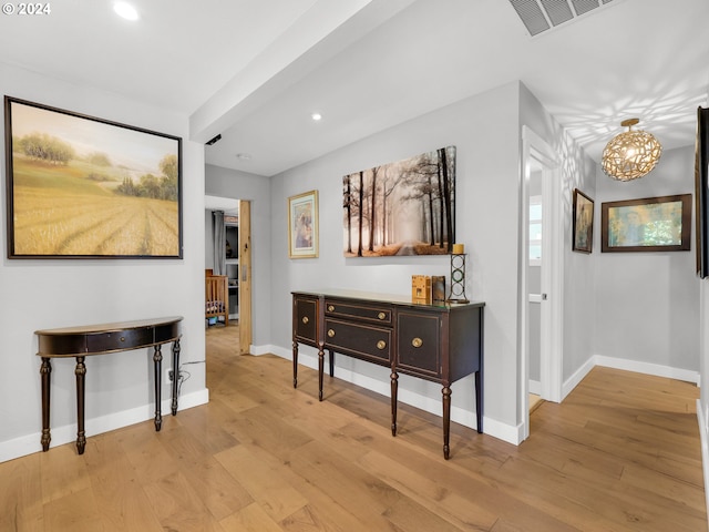 hall with light hardwood / wood-style flooring