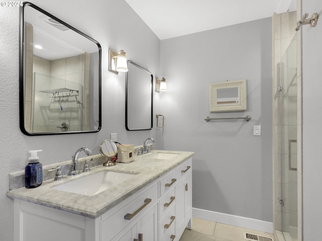 bathroom featuring tile patterned flooring and vanity