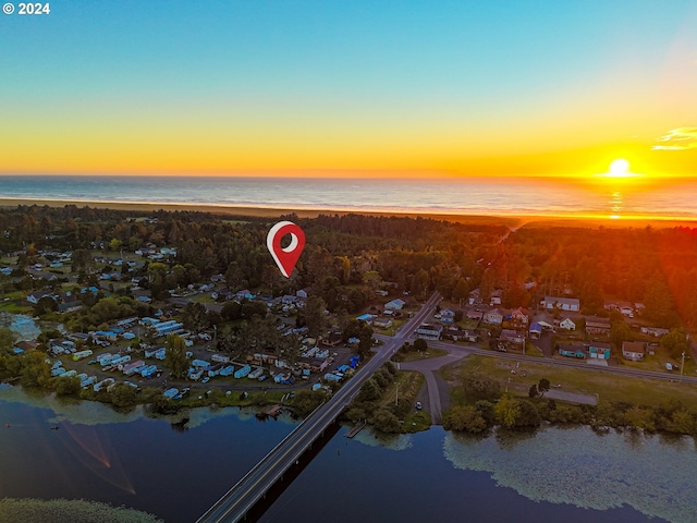 aerial view at dusk with a water view