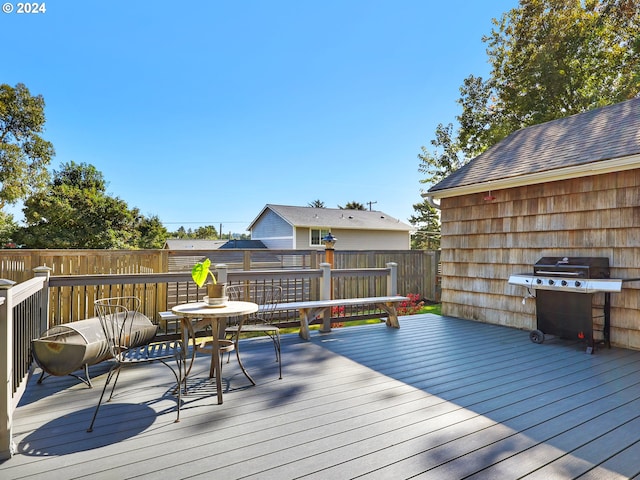 wooden deck with grilling area