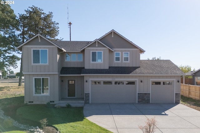 view of front facade featuring a garage and a front lawn