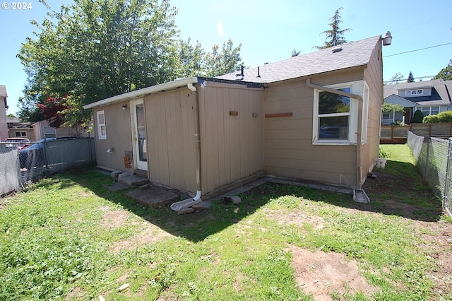 view of property exterior with a lawn