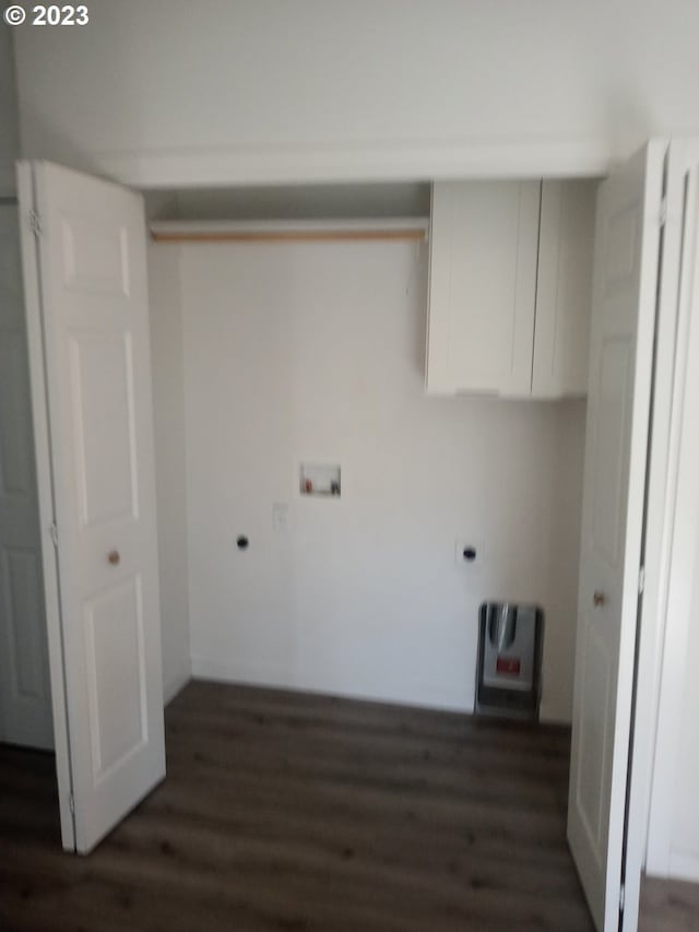 clothes washing area with hookup for an electric dryer, dark hardwood / wood-style flooring, and hookup for a washing machine