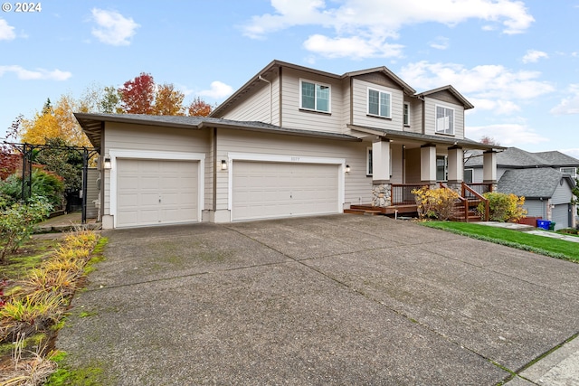 view of front facade with a porch and a garage