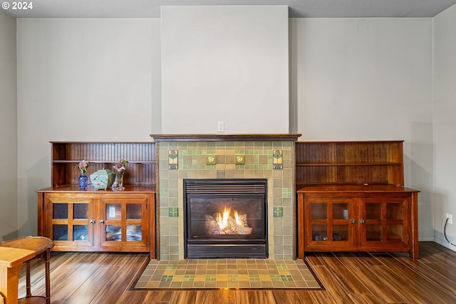 interior details with hardwood / wood-style flooring and a fireplace