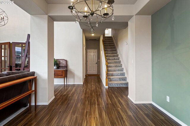 interior space with a chandelier and dark hardwood / wood-style floors