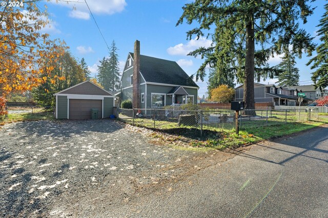 view of front facade with a garage and an outdoor structure