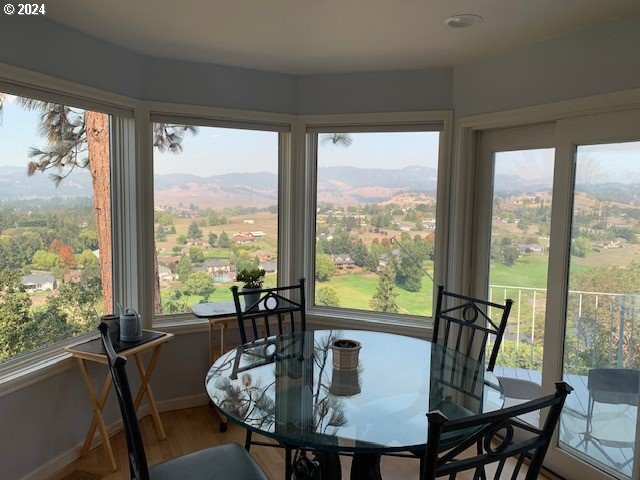 sunroom featuring a mountain view