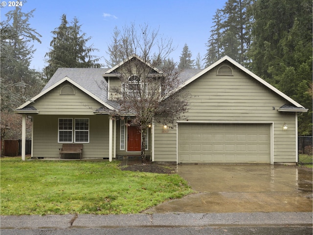 view of front of house with a porch, a front yard, and a garage