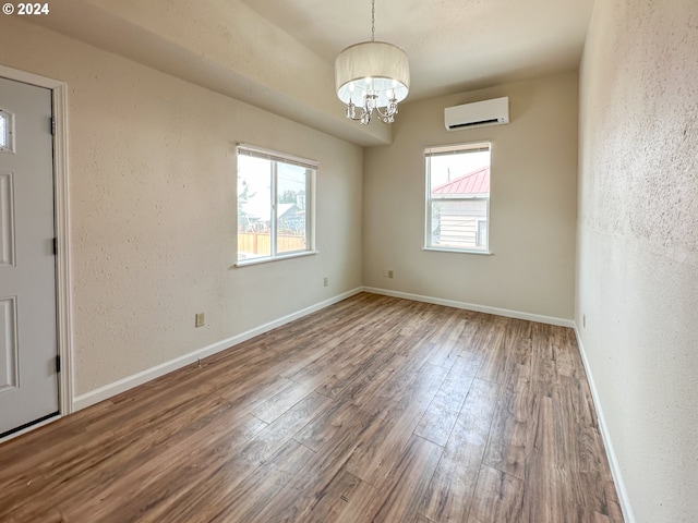 empty room with electric panel and hardwood / wood-style floors