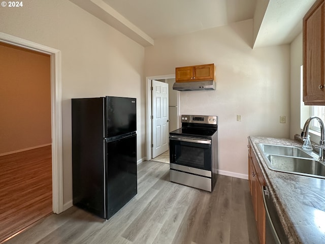 spare room with electric panel and hardwood / wood-style floors