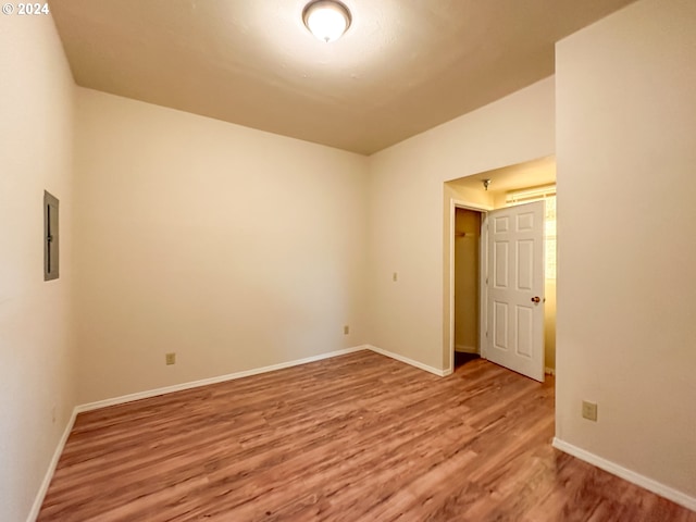 unfurnished bedroom featuring dark wood-type flooring and a closet