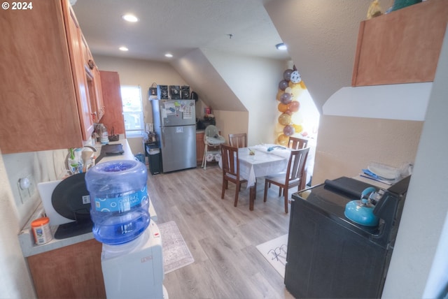 unfurnished room featuring ceiling fan, a wall unit AC, and wood-type flooring